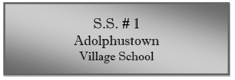 A grey sign with black text
Description automatically generated