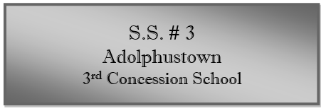 A grey sign with black text
Description automatically generated