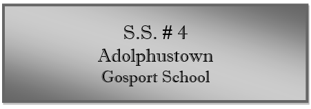 A grey rectangular sign with black text
Description automatically generated