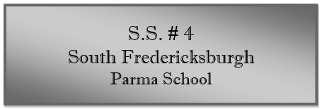 A grey rectangular sign with black text
Description automatically generated